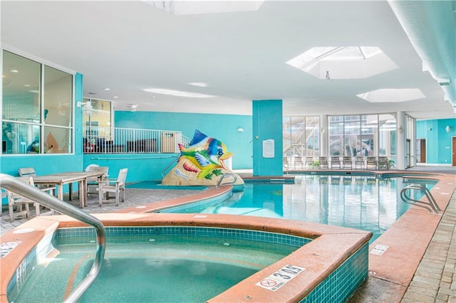 view of swimming pool with a skylight