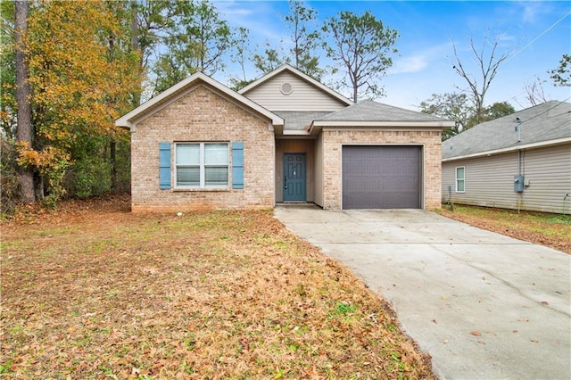 view of front of home with a garage and a front lawn