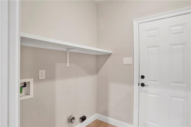 washroom featuring washer hookup and light tile patterned floors