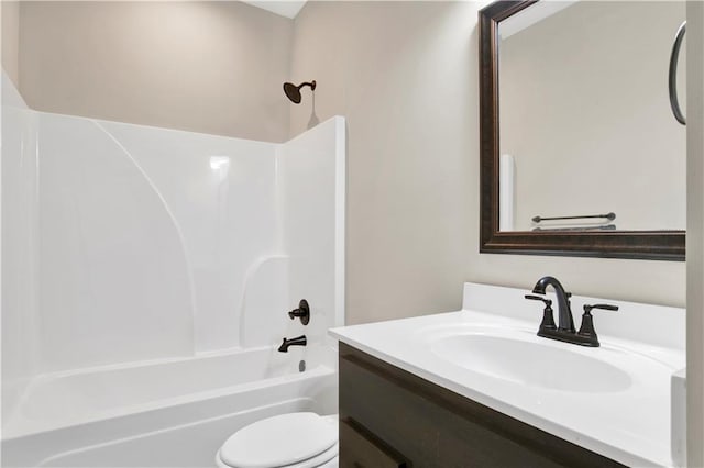 full bathroom with vanity, shower / tub combination, and toilet