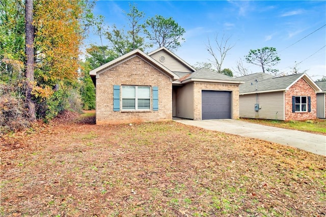 view of front of house with a garage and a front yard