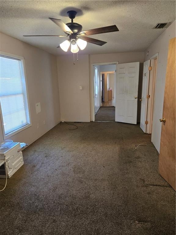 724 Half Ave, Mobile, AL 36610 - carpeted spare room featuring a textured ceiling, ceiling fan, and visible vents