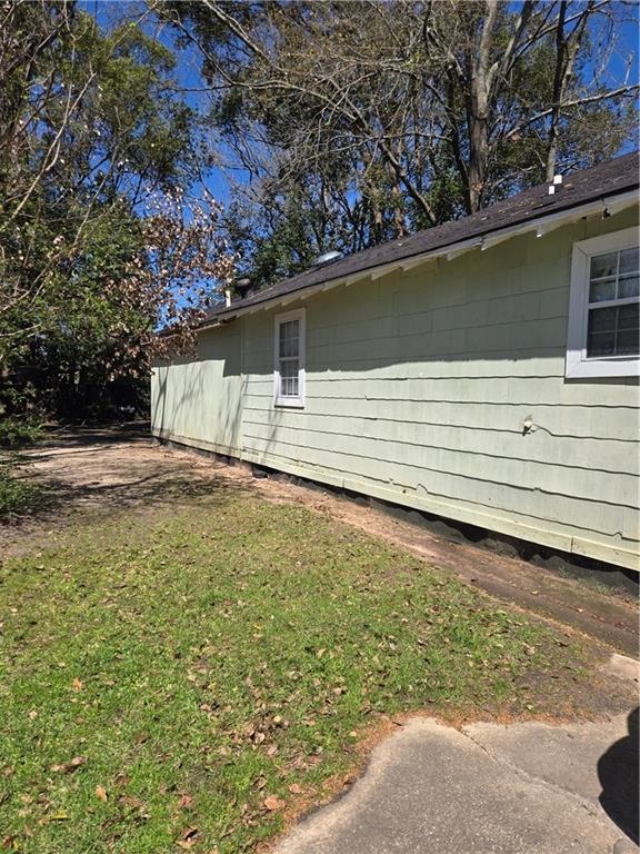 724 Half Ave, Mobile, AL 36610 - view of property exterior with a yard