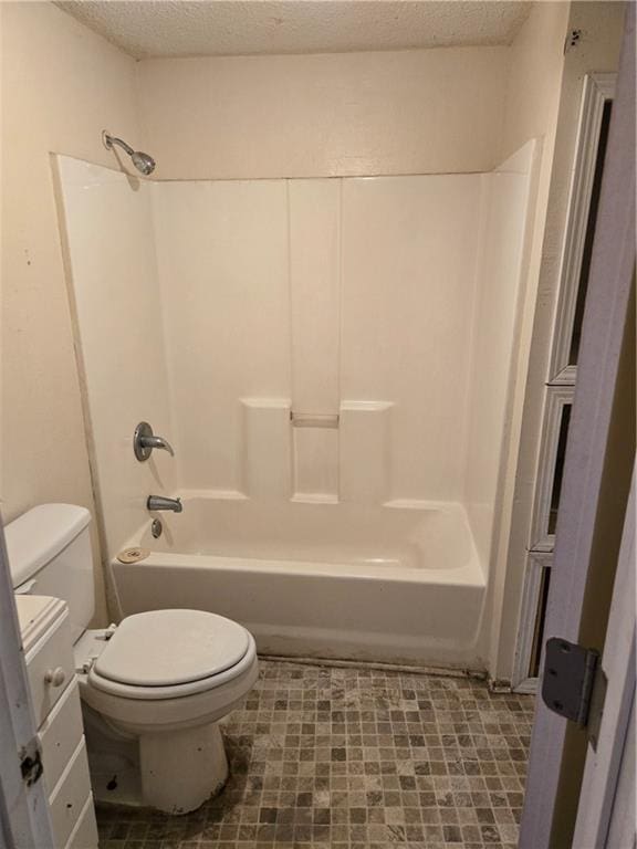 724 Half Ave, Mobile, AL 36610 - bathroom with toilet, tub / shower combination, and a textured ceiling