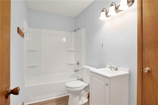full bathroom featuring toilet, vanity, and shower / bathtub combination