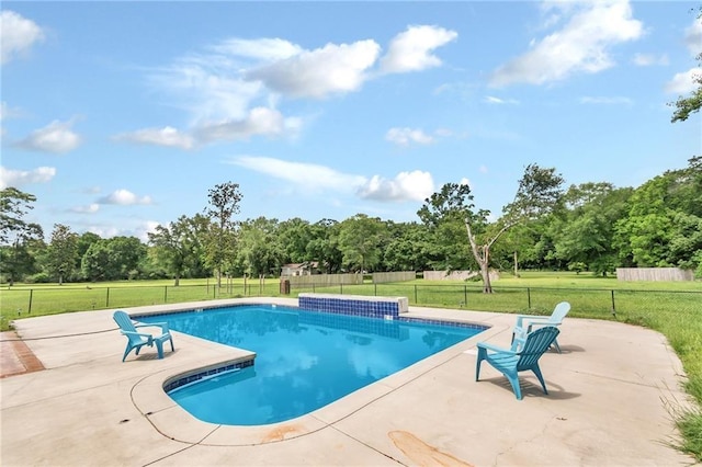 view of pool featuring a fenced in pool, a lawn, and a patio