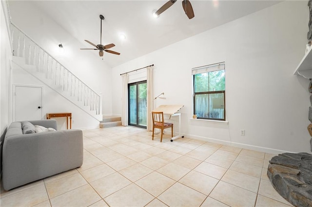 living room with ceiling fan, high vaulted ceiling, and light tile patterned flooring