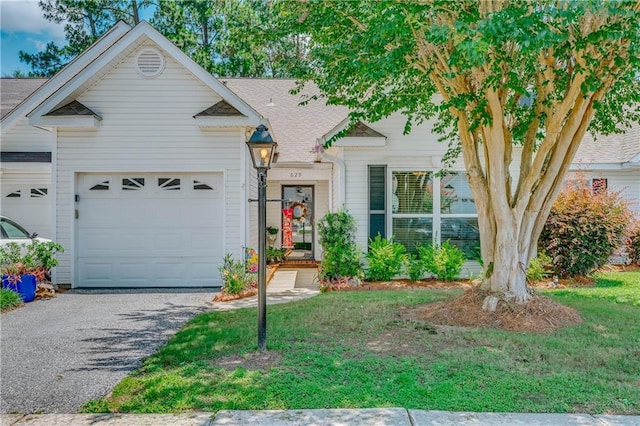 629 Spring Lake Dr W, Mobile, AL 36695 - view of front facade with a garage, driveway, and a shingled roof