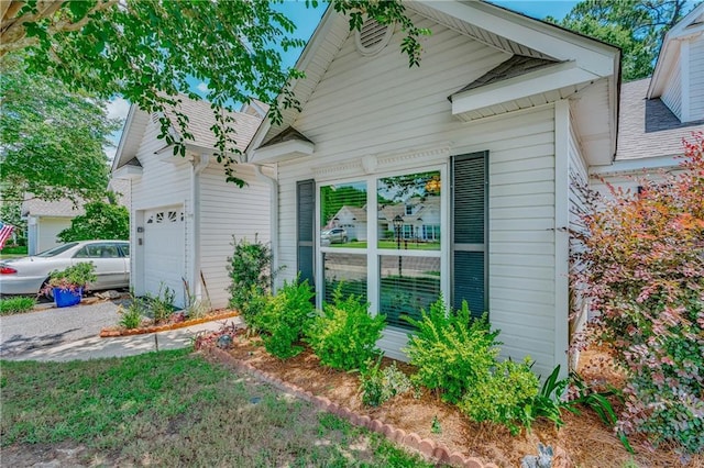 629 Spring Lake Dr W, Mobile, AL 36695 - view of property exterior featuring a garage and driveway