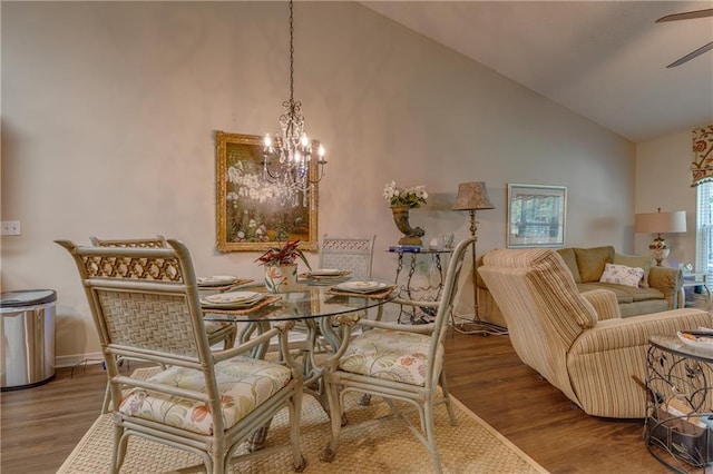 629 Spring Lake Dr W, Mobile, AL 36695 - dining area with high vaulted ceiling, a chandelier, ceiling fan, and wood finished floors