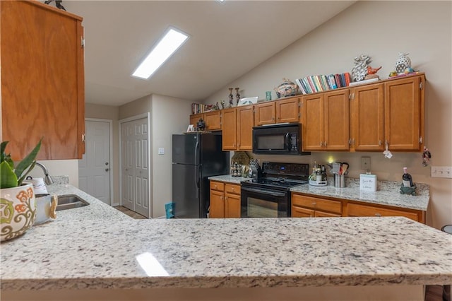 629 Spring Lake Dr W, Mobile, AL 36695 - kitchen featuring black appliances, lofted ceiling, brown cabinetry, light stone counters, and a peninsula