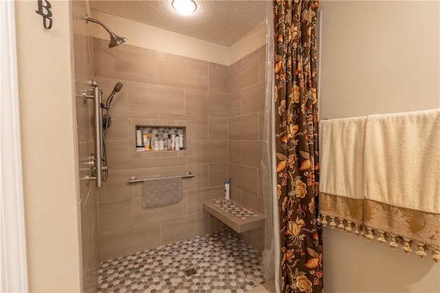 629 Spring Lake Dr W, Mobile, AL 36695 - bathroom featuring a shower stall and a textured ceiling