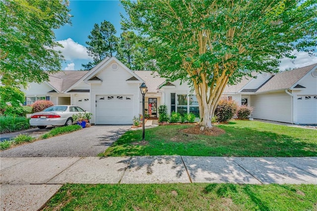 629 Spring Lake Dr W, Mobile, AL 36695 - view of front of house featuring driveway, a garage, and a front lawn