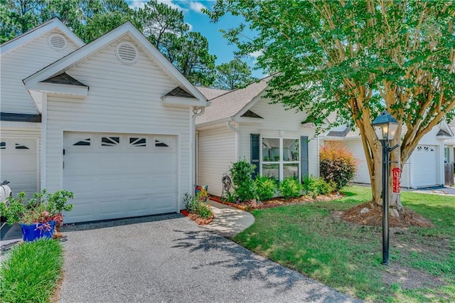 629 Spring Lake Dr W, Mobile, AL 36695 - view of front of home featuring asphalt driveway and an attached garage