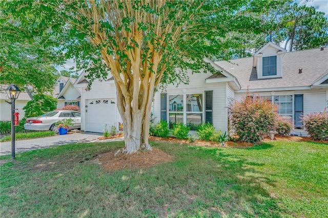 629 Spring Lake Dr W, Mobile, AL 36695 - obstructed view of property with a front lawn, driveway, roof with shingles, and an attached garage