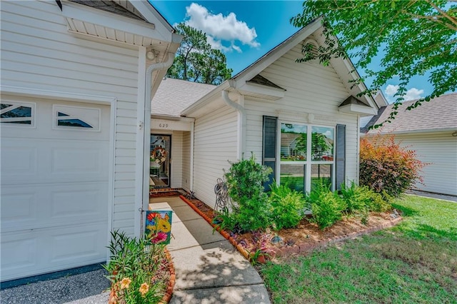 629 Spring Lake Dr W, Mobile, AL 36695 - property entrance with roof with shingles and a garage