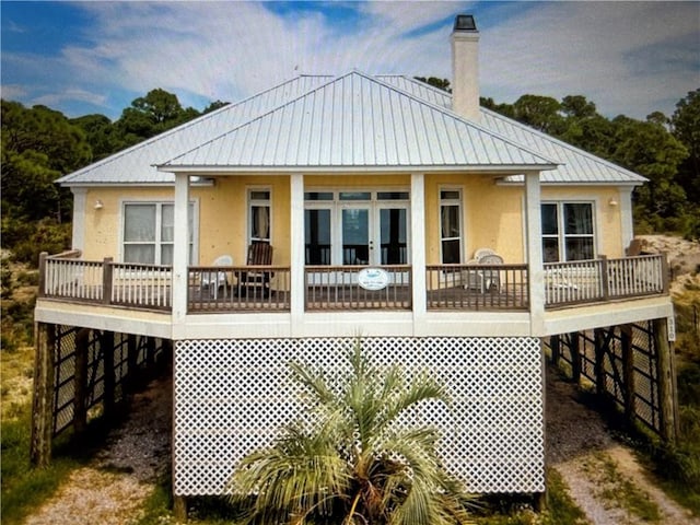 rear view of house with a carport