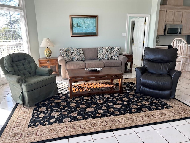 living room with light tile patterned flooring