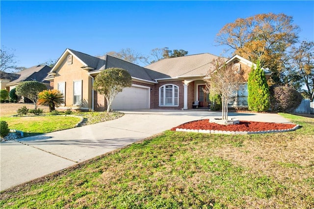 ranch-style home with a garage and a front lawn