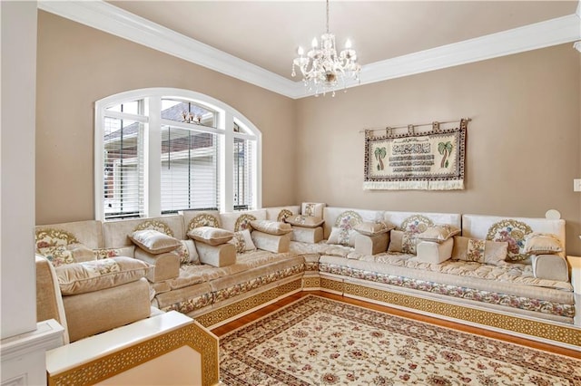 living room featuring ornamental molding and a notable chandelier