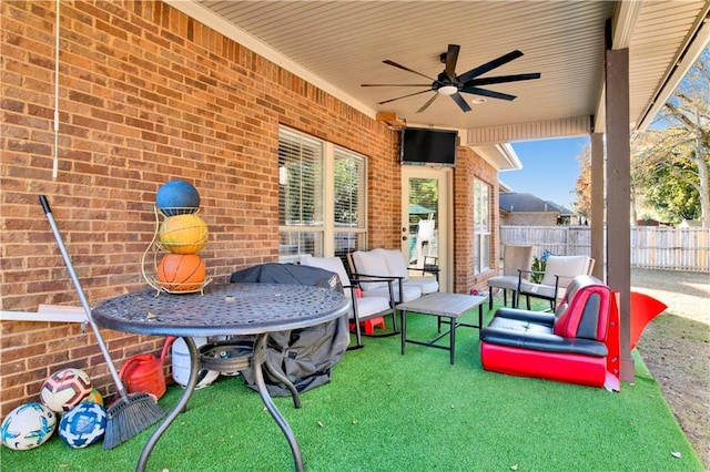 view of patio / terrace featuring ceiling fan