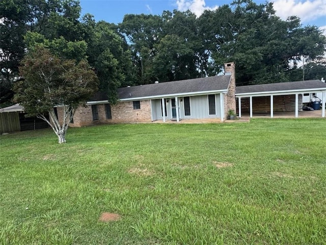 8500 Cindy Lou Dr, Theodore, AL 36582 - ranch-style home featuring a chimney, a front yard, and a carport