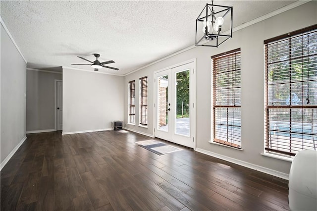 8500 Cindy Lou Dr, Theodore, AL 36582 - unfurnished room featuring french doors, ornamental molding, a textured ceiling, dark wood-style flooring, and healthy amount of natural light