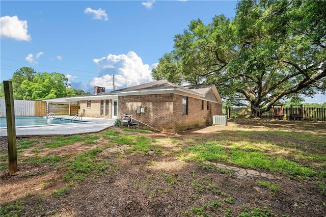 8500 Cindy Lou Dr, Theodore, AL 36582 - back of property featuring a fenced backyard, brick siding, and a patio area