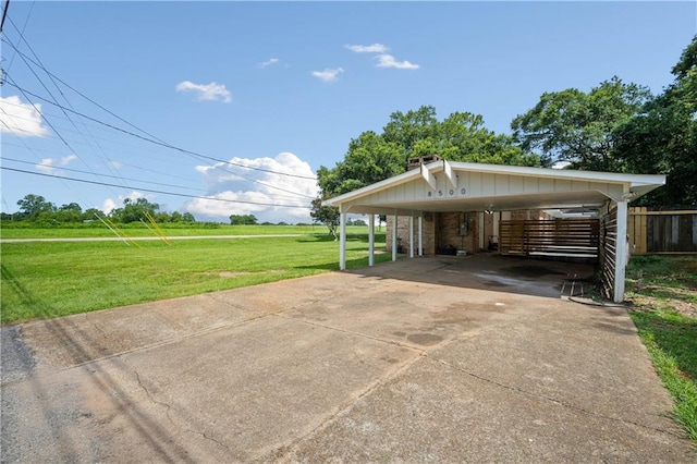 8500 Cindy Lou Dr, Theodore, AL 36582 - view of front of house with a carport, driveway, brick siding, a chimney, and a view of countryside