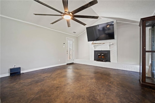 8500 Cindy Lou Dr, Theodore, AL 36582 - unfurnished living room featuring vaulted ceiling, a brick fireplace, ceiling fan, ornamental molding, and concrete floors