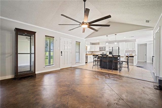 8500 Cindy Lou Dr, Theodore, AL 36582 - dining space with finished concrete floors, a ceiling fan, a textured ceiling, and lofted ceiling