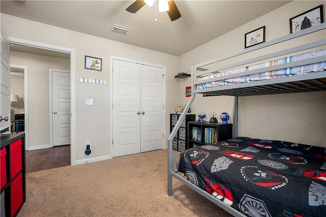 bedroom with a closet, carpet flooring, and ceiling fan