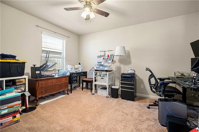 home office with ceiling fan and carpet