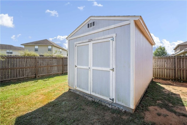 view of outdoor structure with a lawn