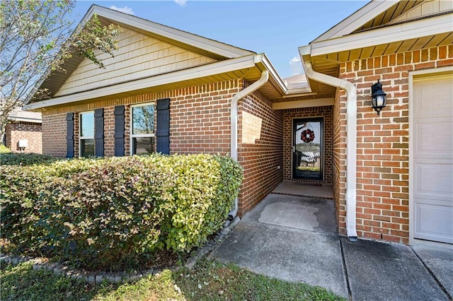 entrance to property featuring a garage