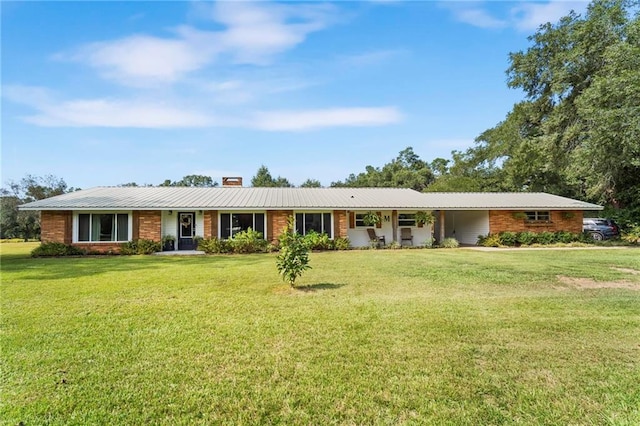 single story home featuring a front lawn