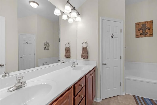 bathroom featuring a sink, double vanity, a bath, and tile patterned floors