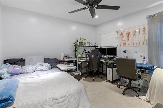 bedroom featuring a ceiling fan and light colored carpet