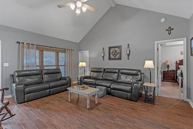 living room with baseboards, high vaulted ceiling, wood finished floors, and beamed ceiling