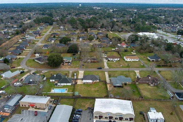 birds eye view of property with a residential view