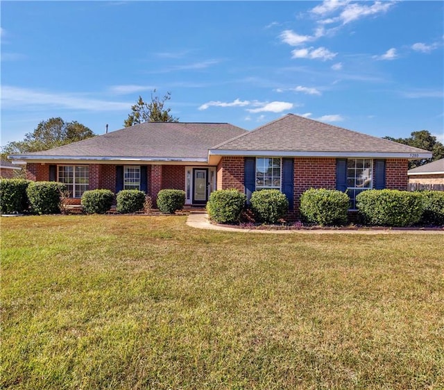 ranch-style home with a front lawn