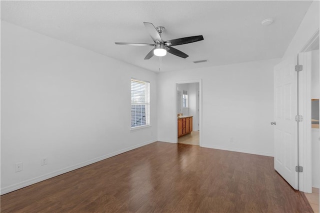 empty room with wood-type flooring and ceiling fan