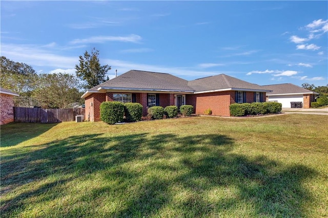 ranch-style home with central air condition unit, a front yard, and a garage