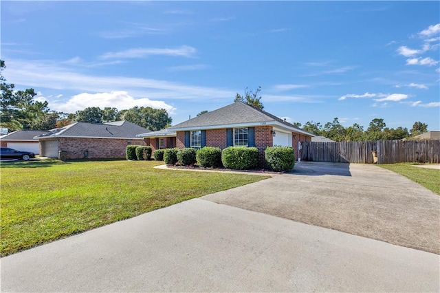 ranch-style house featuring a garage and a front lawn