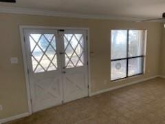 entryway featuring ornamental molding