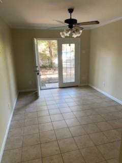 tiled empty room featuring ceiling fan