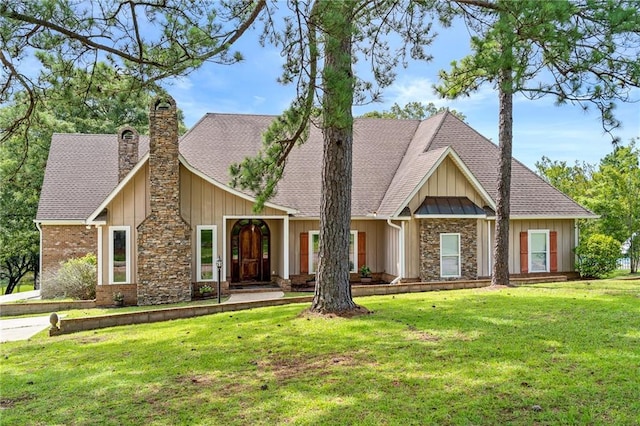 craftsman inspired home with a front lawn