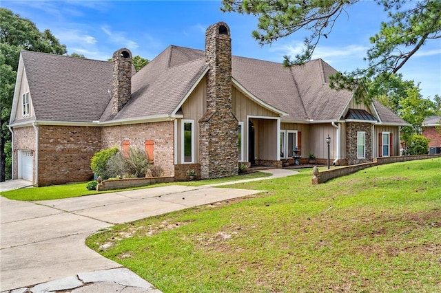 view of front of property featuring a garage and a front yard