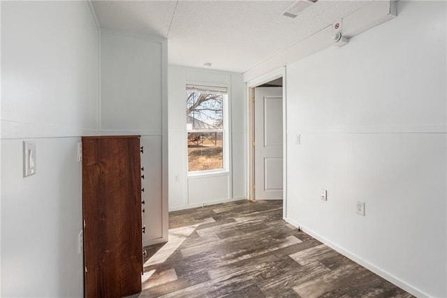 hallway featuring dark wood-type flooring