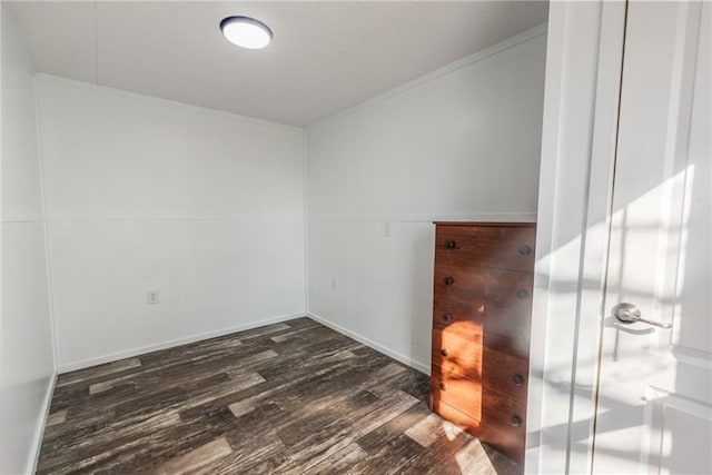 unfurnished room featuring dark wood-type flooring